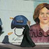 A mural of slain Al Jazeera journalist Shireen Abu Akleh, who was shot and killed during an Israeli military raid in the West Bank city of Jenin, adorns a wall in Gaza City on May 15, 2022.