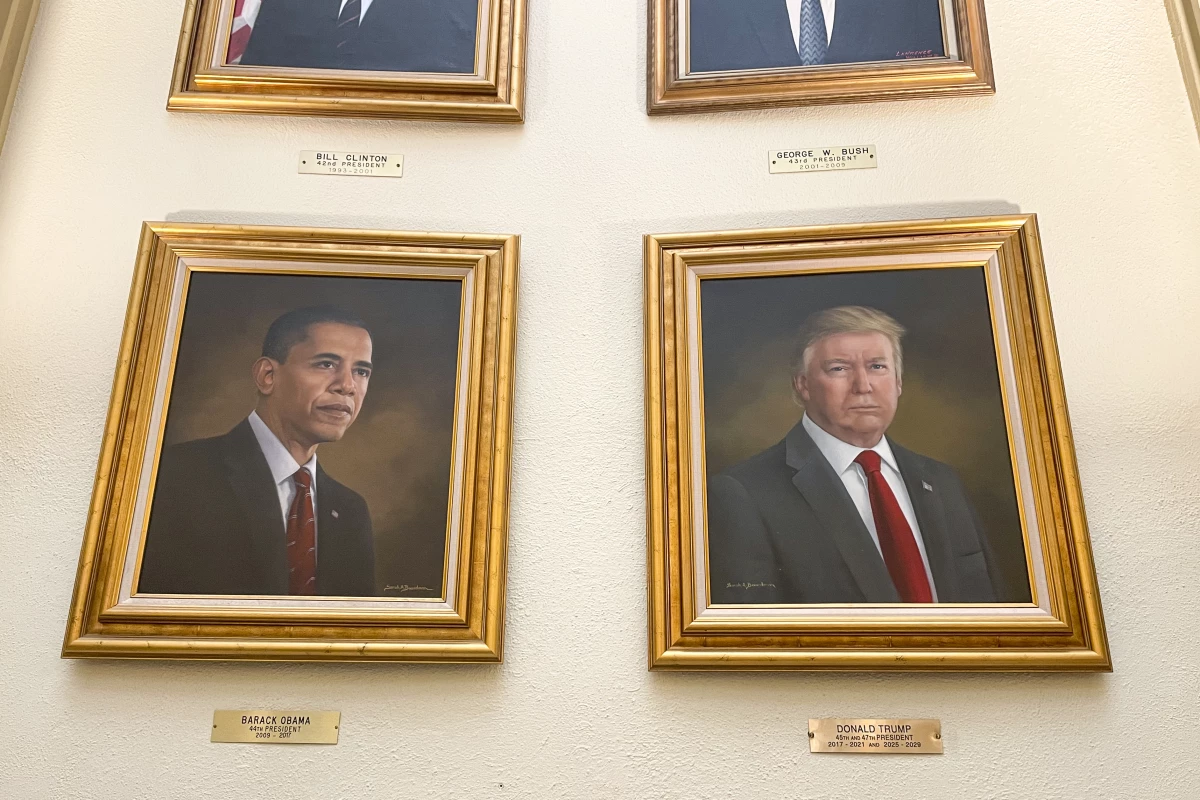 Portraits of President Donald Trump and former President Barack Obama, painted by artist Sarah Boardman, hang in the Capitol Rotunda in Denver last month. The Trump portrait has since been taken down.