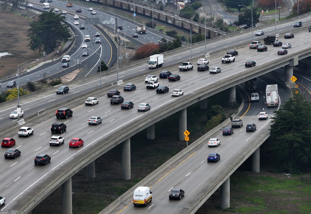 In an aerial view, cars travel along Interstate 80 in Berkeley, Calif., on January 16, 2024. The regulations that require automakers to build more efficient, cleaner vehicles are being loosened under the Trump administration. (Getty Images North America)