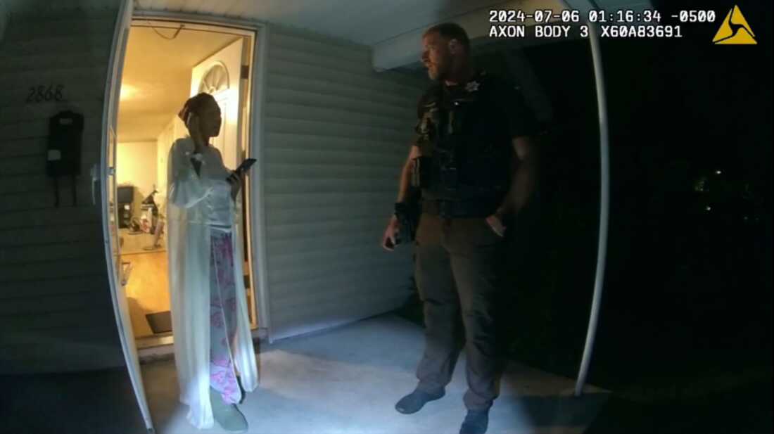 FILE - In this image from body camera video released by Illinois State Police, Sonya Massey, left, talks with Sangamon County Sheriff's Deputy Sean Grayson outside her home in Springfield, Ill., July 6, 2024.