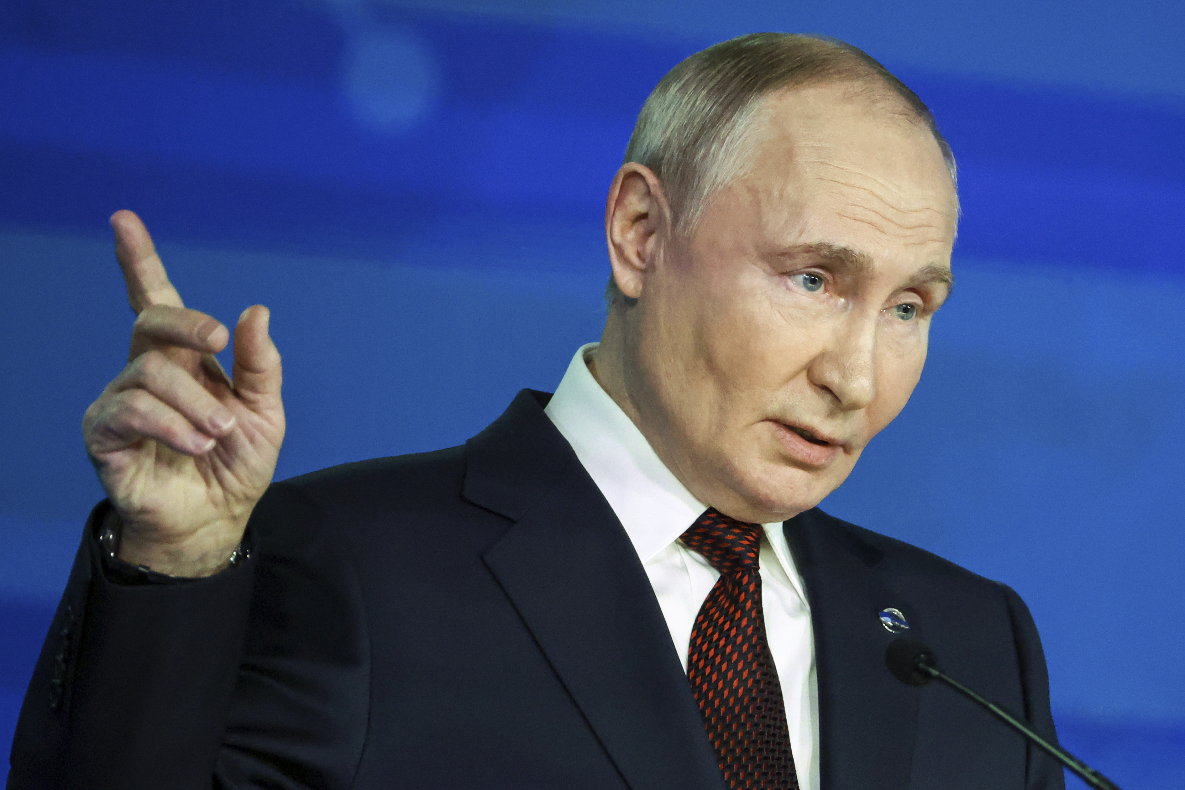 Russian President Vladimir Putin points during a meeting with foreign policy experts at the Valdai Discussion Club in the Black Sea resort of Sochi, Russia, Thursday. (Pool EPA via AP)