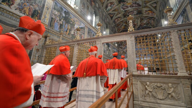 Cardinals file into the Sistine Chapel for a conclave to elect a new pope on March 12, 2013 in the Vatican.