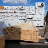 Mel Gutherie, president of Gutherie Lumber, walks among Canadian lumber products on Aug. 25 in Livonia, Mich.