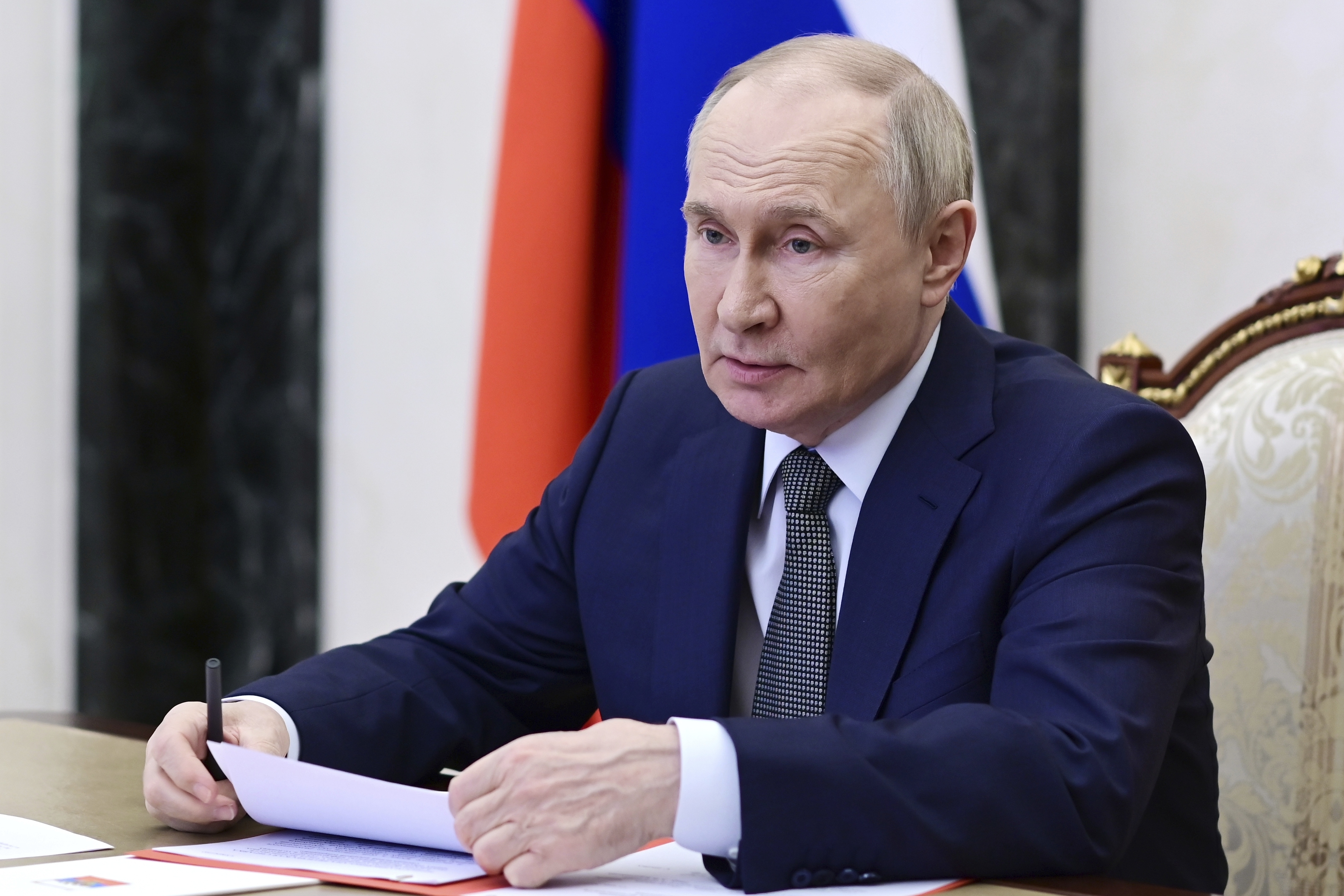 Russian President Vladimir Putin chairs a Security Council meeting via videoconference at the Kremlin in Moscow, Friday.