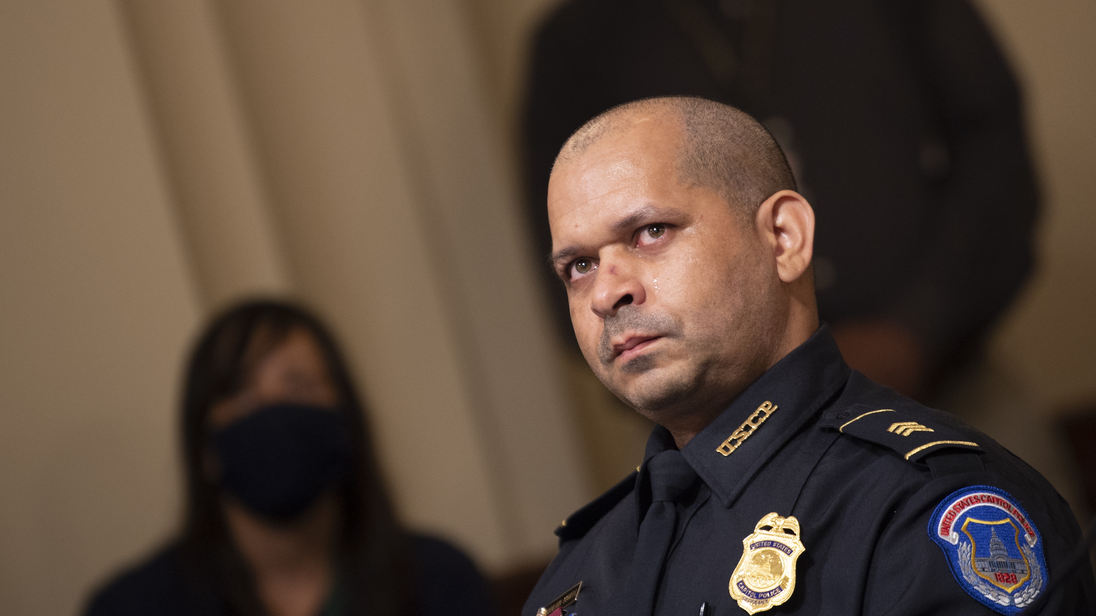 Capitol Police Sgt. Aquilino Gonell watches a video of rioters during a hearing of the House select committee investigating the Jan. 6 attack on the U.S. Capitol on July 27, 2021 in Washington, D.C.