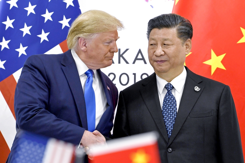 President Donald Trump shakes hands with China's President Xi Jinping during a meeting on the sidelines of the G-20 summit in Osaka, Japan, June 29, 2019. (AP)