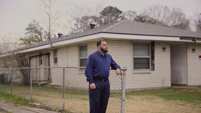 Dustin Vidrine stands outside his house in Lafayette, La.