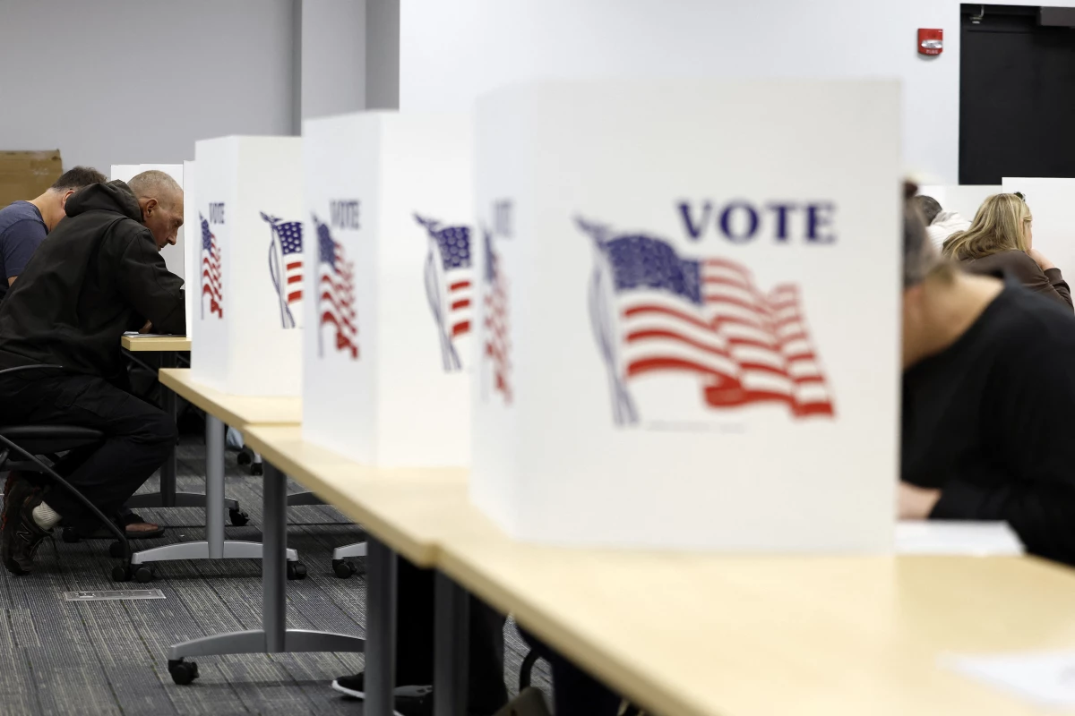 People cast ballots in Howell, Mich., on Sunday.