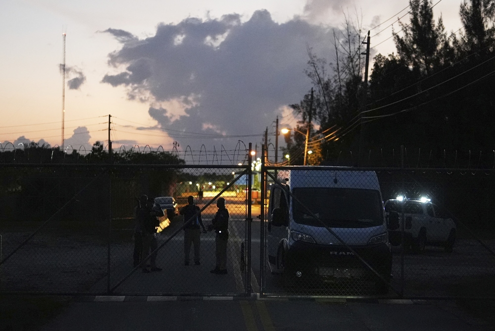 Krome Detention Center officers man a gate leading to the U.S. Immigration and Customs Enforcement facility, May 24, 2025, in Miami. (AP)