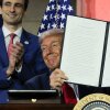 President Trump displays a signed executive order after delivering remarks on his AI plan at the Andrew W. Mellon Auditorium on July 23, 2025 in Washington, DC. /Getty Images)