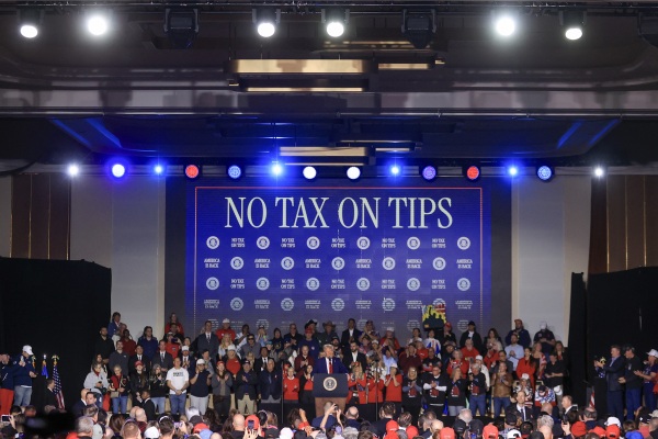 President Trump speaks at a rally at Circa Resort & Casino on Saturday. The event focused on Trump's first week in office, including his proposed policy to eliminate taxes on tips for service industry employees.