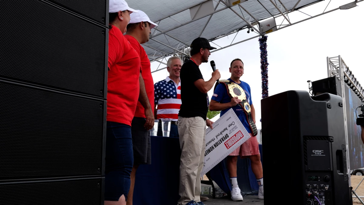 Joey Chestnut (right) won a hot dog-eating contest against soldiers at Fort Bliss in El Paso, Texas, on Thursday, with Impossible Foods pledging to donate $1,000 in support of military families for each hot dog downed.