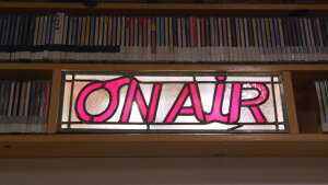 KCAW On Air sign by Adam Pogoff for the Public Media Bridge Fund.