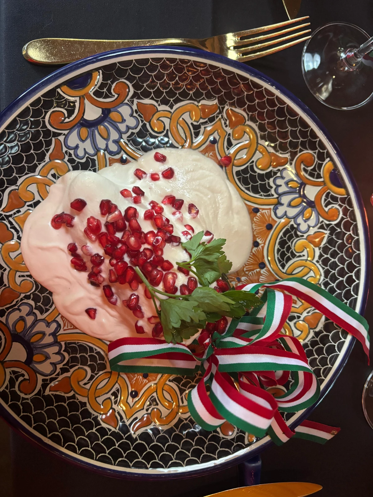 Chiles en nogada, a traditional dish that is eaten in Mexico from August to early October. Made from poblano peppers, stuffed with meat, pears, peaches, pine nuts and sometimes — but not in this case — acitrón, and bathed in nogada, a walnut cream sauce, and garnished with pomegranate seeds and parsley.