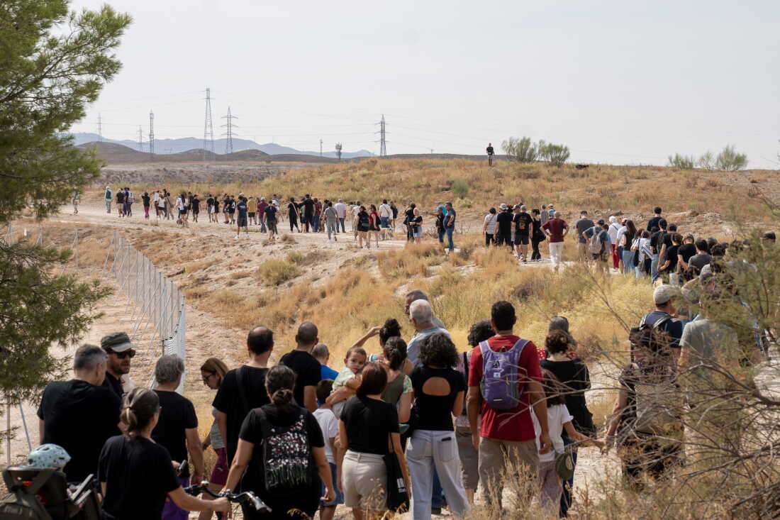 ZARAGOZA, SPAIN - SEPTEMBER 27, 2026 Hundreds of demonstratos walk through a forested area near where a Microsoft data center is being built in Zaragoza, Spain on September 27, 2026. The Spanish region of Aragon is seeing a huge surge in data center construction which has alarmed many local residents due to their high energy use, noise pollution and heat generation. Amazon and Mircrosoft are currently building massive data centers complex outside of Spain’s fourth largest city. Activists and protesters say that the arid region of Spain does not have the water to spare for the thirsty infrastructure. Amazon alone is building 30 data center buildings, according to papers they filed with the regional government. (Photo by Michael Robinson Chávez for National Public Radio)