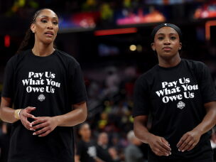 A'ja Wilson and Jackie Young of the Las Vegas Aces wear shirts saying