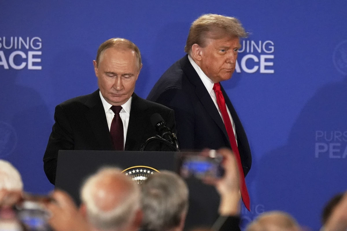 President Donald Trump, right, Russia's President Vladimir Putin arrive for a joint press conference at Joint Base Elmendorf-Richardson, Alaska, Friday, Aug. 15, 2025. (AP Photo/Jae C. Hong)