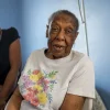 Cookie Jones, left, quit her job to provide care to her mother who has Alzheimer's disease. Caregivers often earn less as they take time off work to help aging family members.