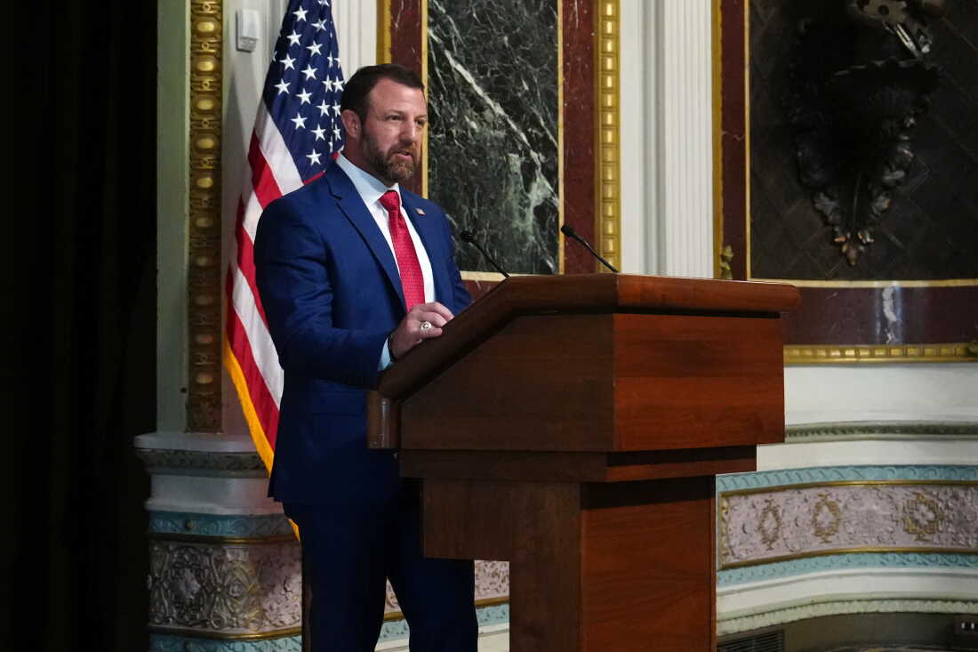 Homeland Security Secretary Markwayne Mullin speaks at a podium in the Eisenhower Executive Office Building on July 17.