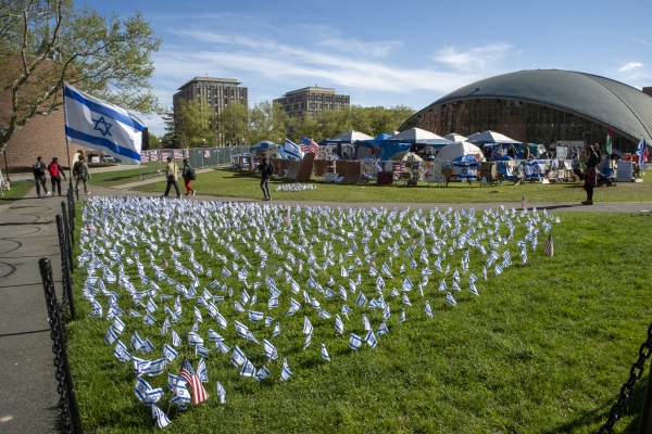 Israeli flags fly in front of a pro-Palestinian encampment in May on the lawn of the Stratton Student Center campus at the Massachusetts Institute of Technology in Cambridge, Mass.