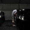A voter casts a ballot at a vote center set up in a tent in Las Vegas on June 9.