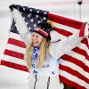 Bronze medallist, Jessie Diggins of Team United States celebrates with a flag during the Women's Cross-Country Sprint Free Final flower ceremony on Day 4 of the Beijing 2022 Winter Olympic Games at The National Cross-Country Skiing Centre on February 08, 2022 in Zhangjiakou, China. (Photo by Matthias Hangst/Getty Images)