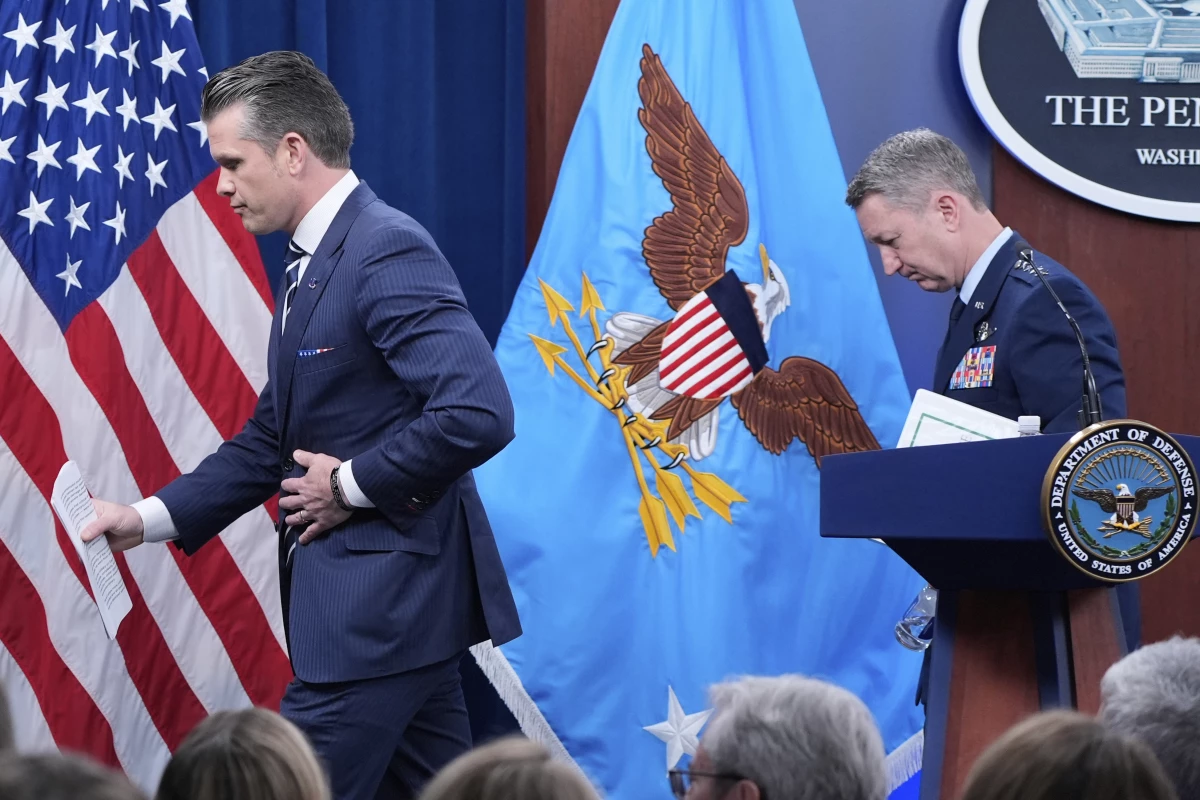 Defense Secretary Pete Hegseth and Joint Chiefs Chairman Gen. Dan Caine depart at the end of a news conference at the Pentagon in Washington, Sunday, June 22, after the U.S. military struck three sites in Iran, directly joining Israel's effort to destroy the country's nuclear program.