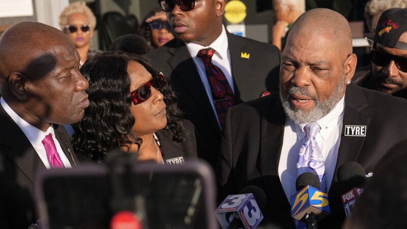 Rodney Wells, right, stepfather of Tyre Nichols, speaks during a news conference with his wife RowVaughn Wells, center, and attorney Ben Crump, left, outside the federal courthouse Thursday after three former Memphis police officers were convicted of witness tampering charges in the 2023 fatal beating of their son in Memphis, Tenn.
