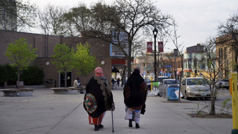 Women walk down a street in the predominantly Somali neighborhood of Cedar-Riverside in Minneapolis in 2022. The Twin Cities is a hub for Somalis in the U.S.