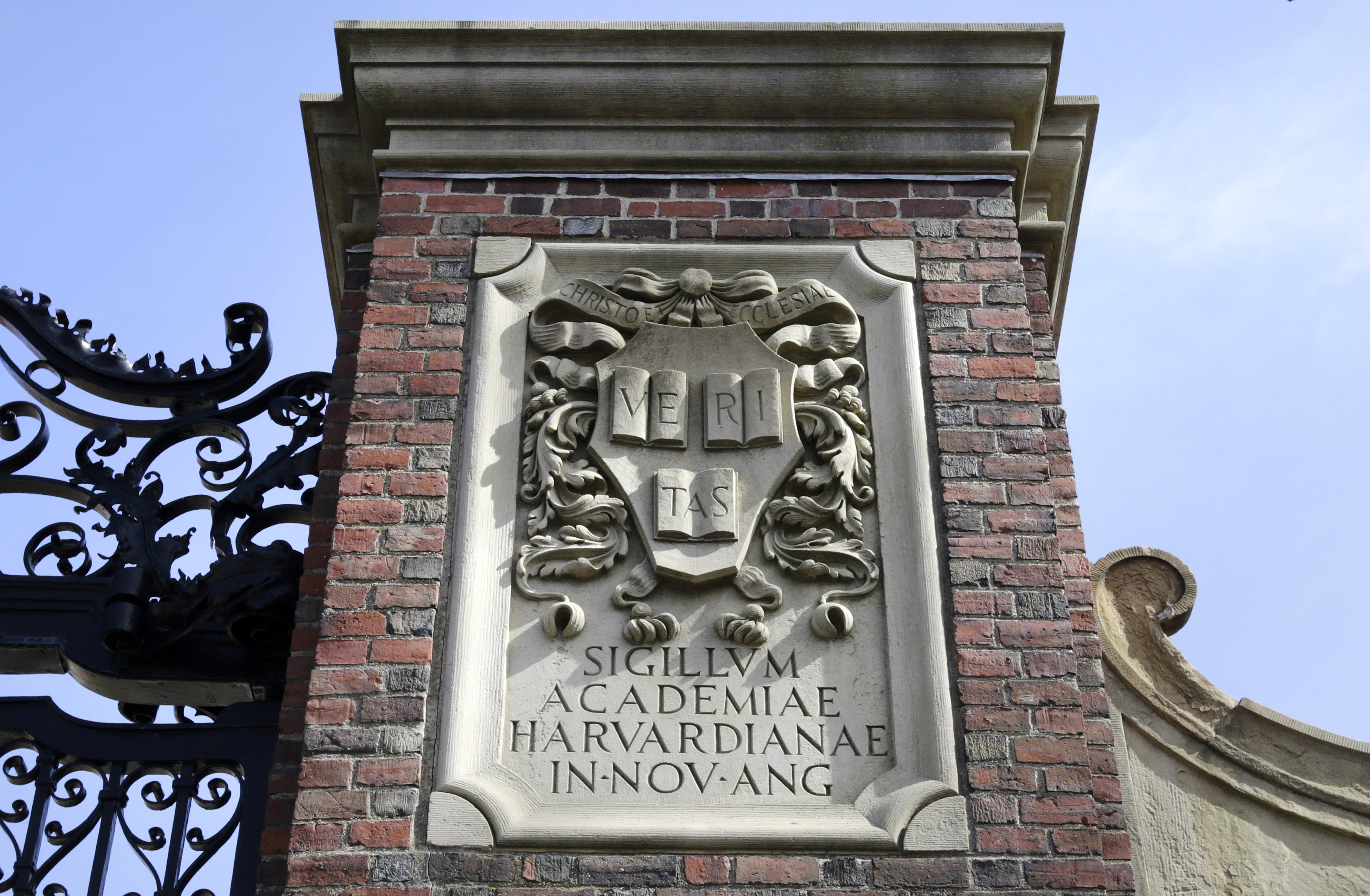 A relief sculpture rests on a gate to the entrance of Harvard University, in Cambridge, Mass., March 13, 2016. (AP)