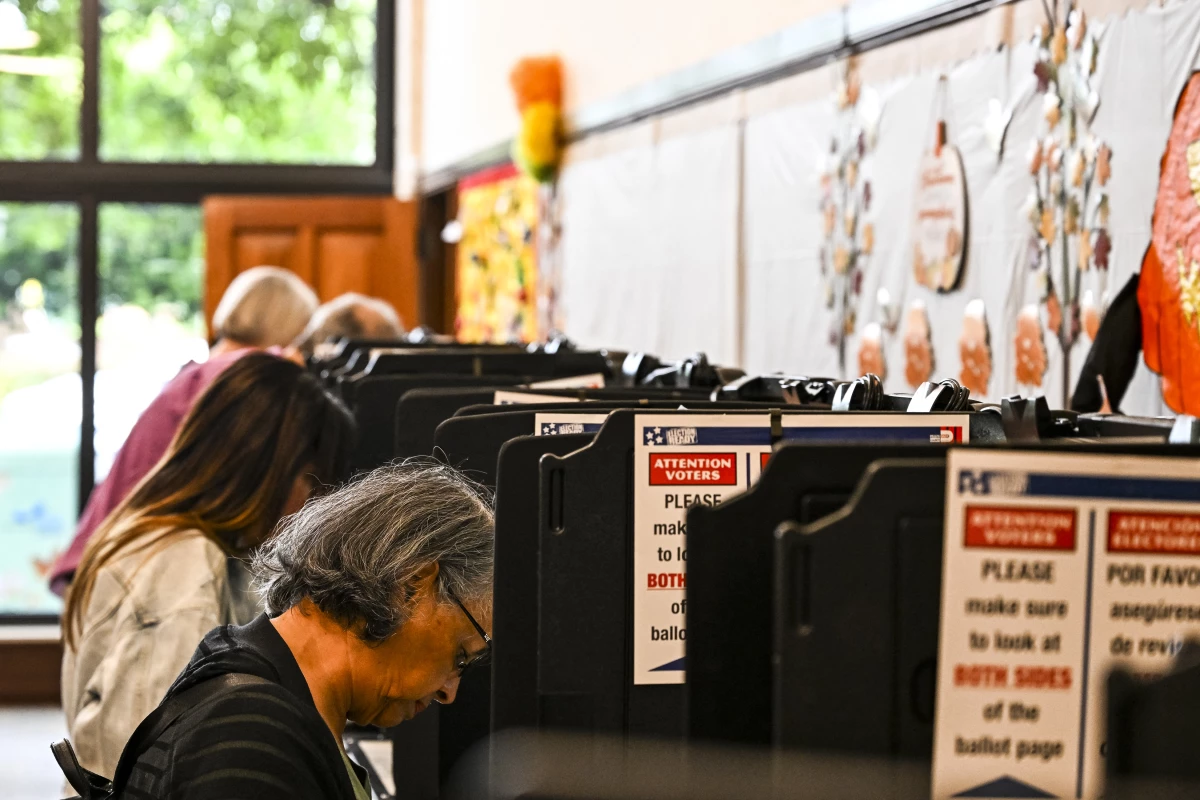 Voters cast their ballots at a library in Coral Gables, Fla., on Oct. 21.
