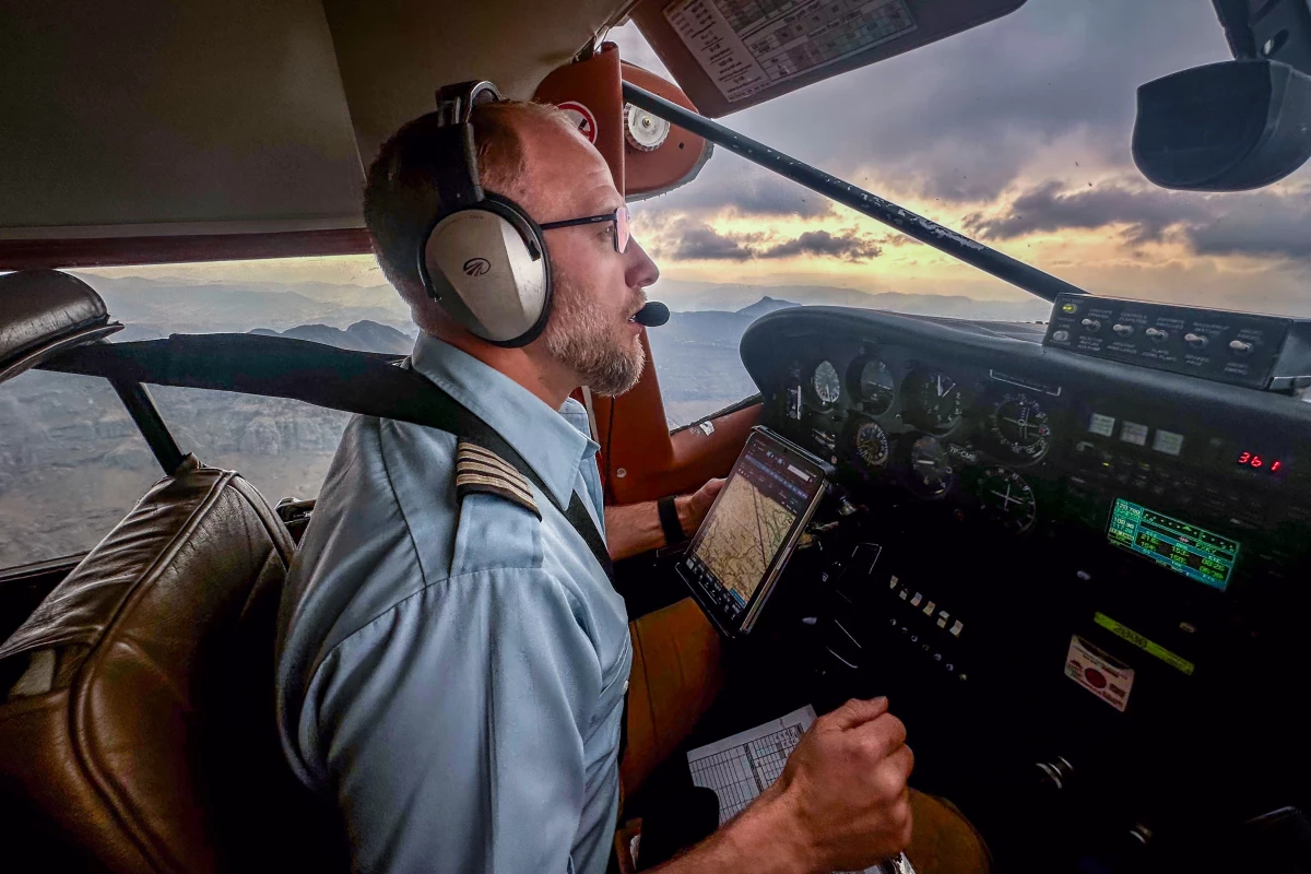 Pilot Joe Adams flies a team from the Lesotho Flying Doctor Service over mountainous terrain in the highlands of Lesotho. Adams, originally from Washington state, has been working with the program since 2019.