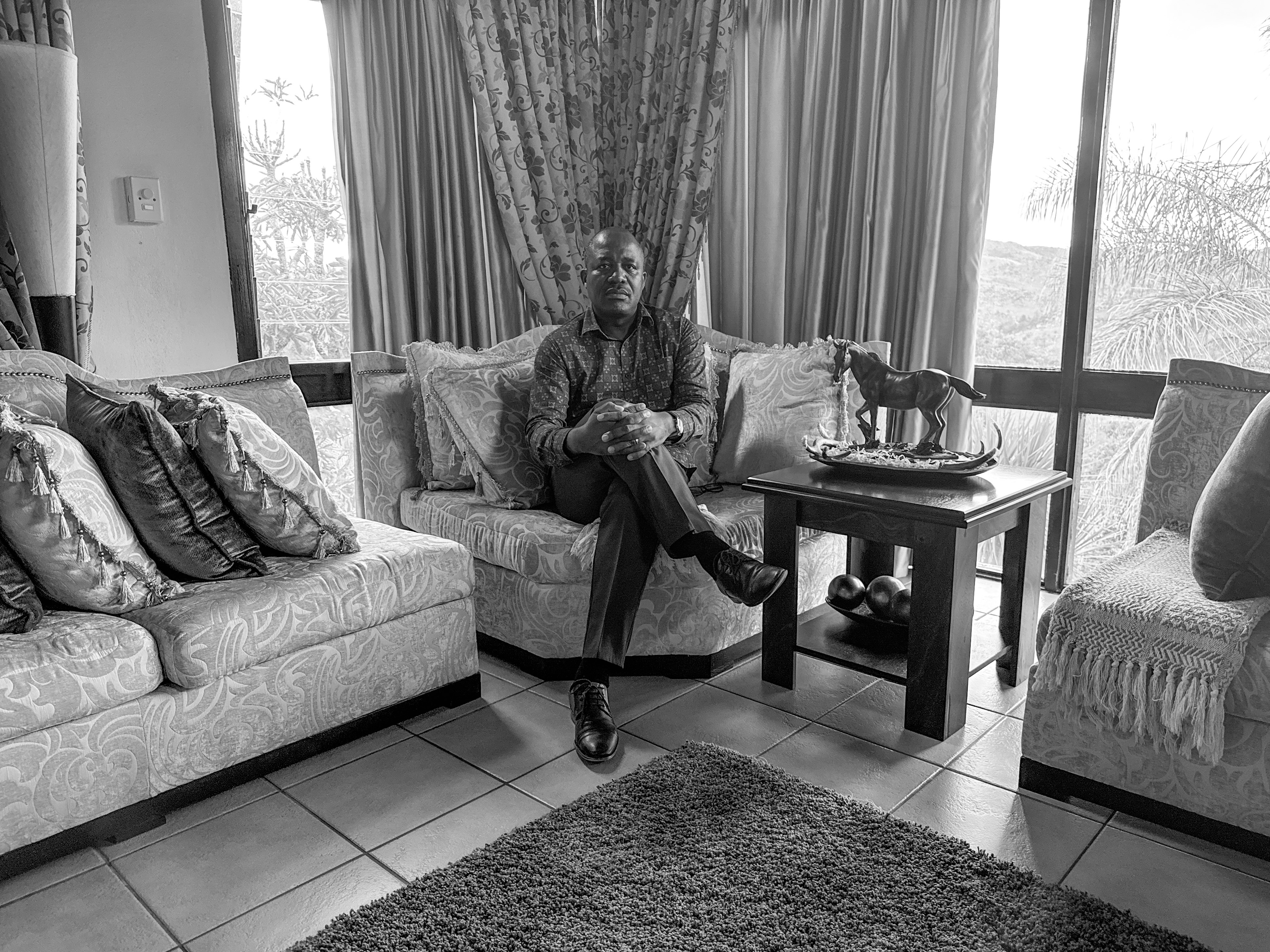 Dr. Caspian Chouraya in his home in Mbabane, Eswatini, says U.S. funding cuts have meant many of his projects have shut down, like support groups for teenagers with HIV.