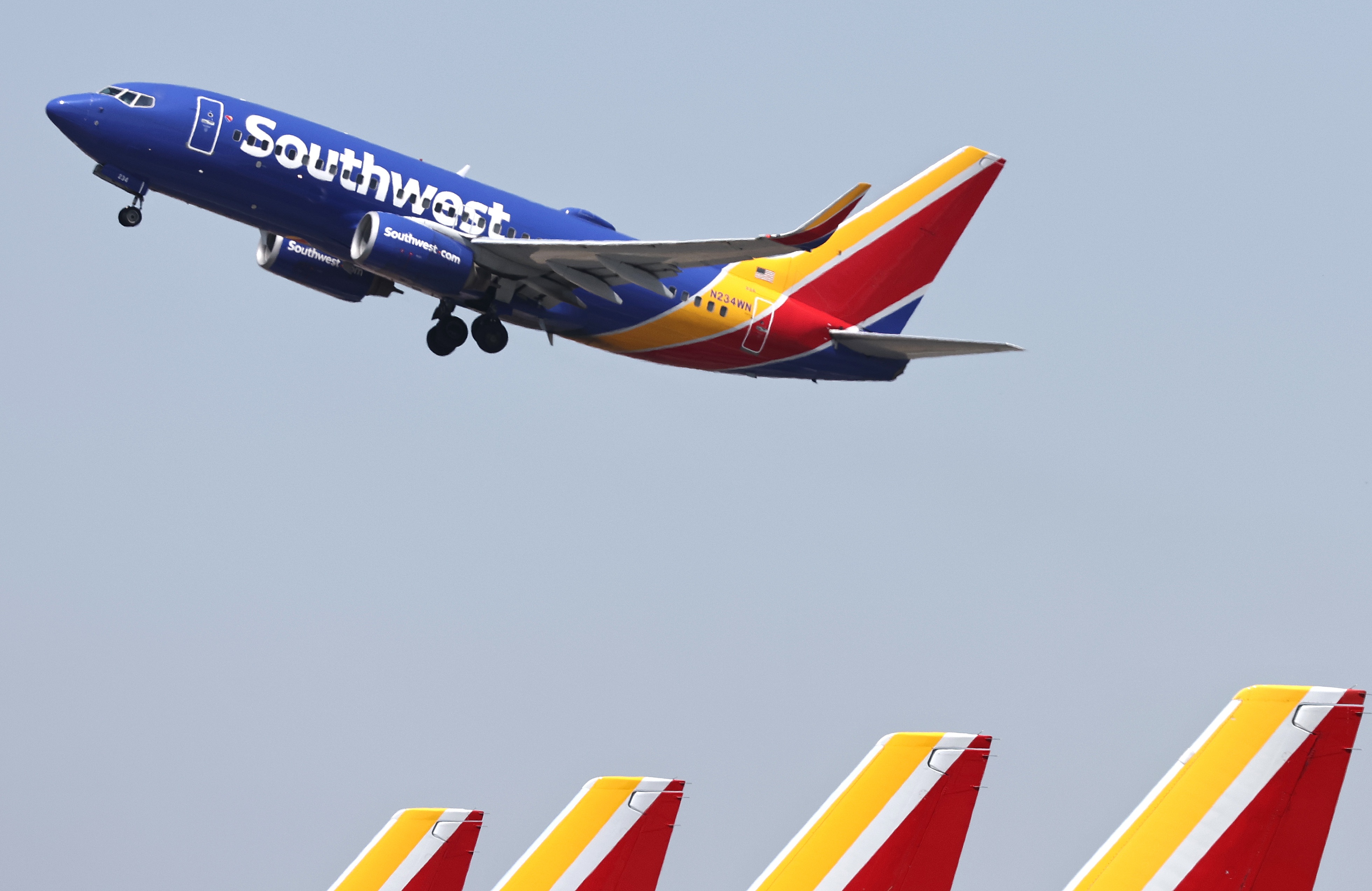 A Southwest Airlines plane takes off from Hollywood Burbank Airport. On Friday, a Southwest plane leaving from the same location had a near-miss with another aircraft.