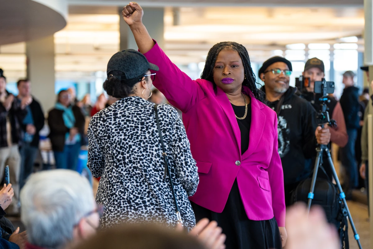 Nekima Levy Armstrong holds up her fist after speaking at an anti-ICE rally for Martin Luther King Jr. on Jan. 19 in St. Paul, Minn.