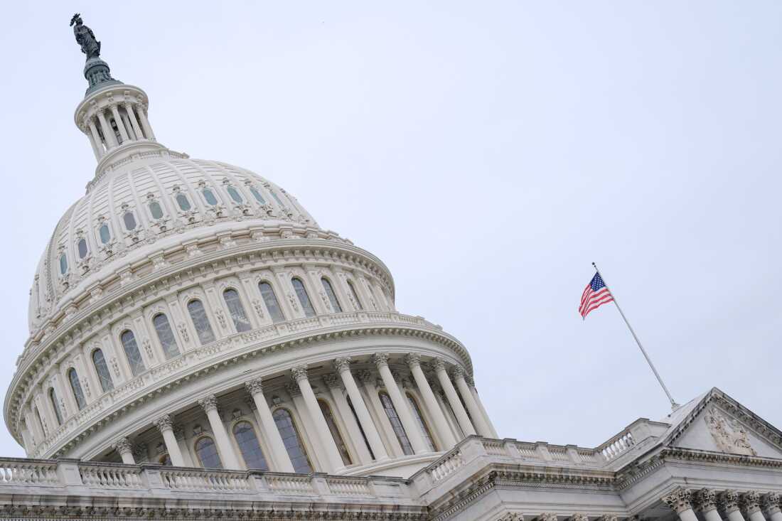The American flag flies atop the Capitol Building, Monday, Sept. 29, 2025, in Washington. (AP Photo/Mariam Zuhaib)