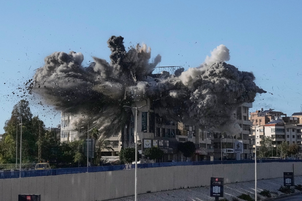 Smoke rises after an Israeli airstrike hits a building near the airport road in Beirut, Lebanon, Tuesday. (AP)
