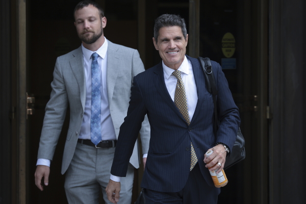 John Lauro (R), an attorney for former President Donald Trump, departs the E. Barrett Prettyman U.S. Court House in 2023.
