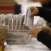 An election worker processes mail-in ballots in June in Industry, Calif.
