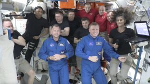 Butch Wilmore, far left, and Suni Williams, far right, welcome Nick Hague, front left in blue, and Alexander Gorbunov, front right in blue, on Sunday. Behind them, from left in black, are NASA's Jeanette Epps, Russia's Alexander Grebenkin, NASA's Mike Barratt and NASA's Matthew Dominick. From left, in red, are Russia's Ivan Vagner, NASA's Don Pettit and Russia's Alexei Ovchinin.