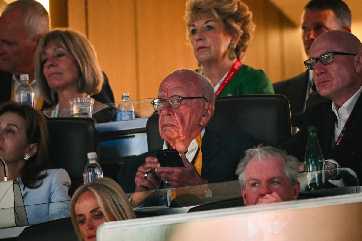 Rupert Murdoch, center, at the Republican National Convention in July. Murdoch has led his media empire to become a major player in conservative politics.