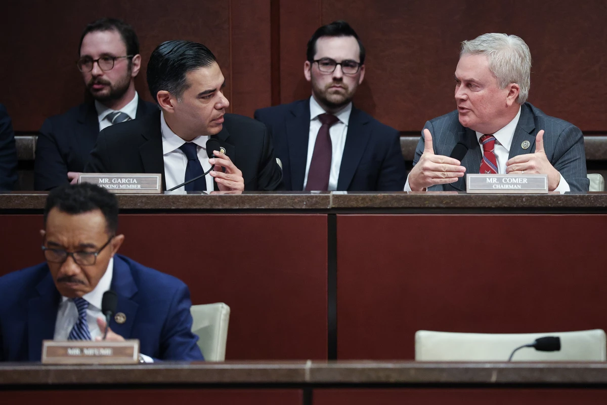 House Oversight and Government Reform Committee chairman Rep. James Comer, R-Ky. (pictured right), and ranking member Rep. Robert Garcia, D-Calif., confer during a hearing Wednesday on whether to hold former President Bill Clinton and former Secretary of State Hillary Clinton in contempt of Congress.