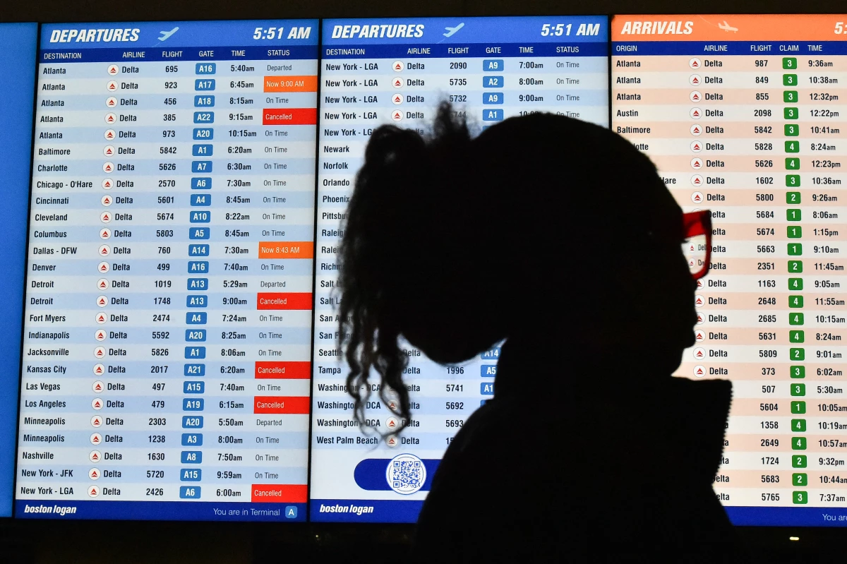 Several canceled flights are displayed on a departures board at Boston Logan International Airport on Monday.