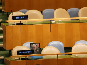 A photo of the late Qassem Soleimani, the architect of Iran's regional military activities, is displayed as chairs for delegates from Iran are unoccupied while Israeli Prime Minister Benjamin Netanyahu speaks at the United Nations in New York, Thursday. Soleimani was killed in a U.S. attack in 2020.