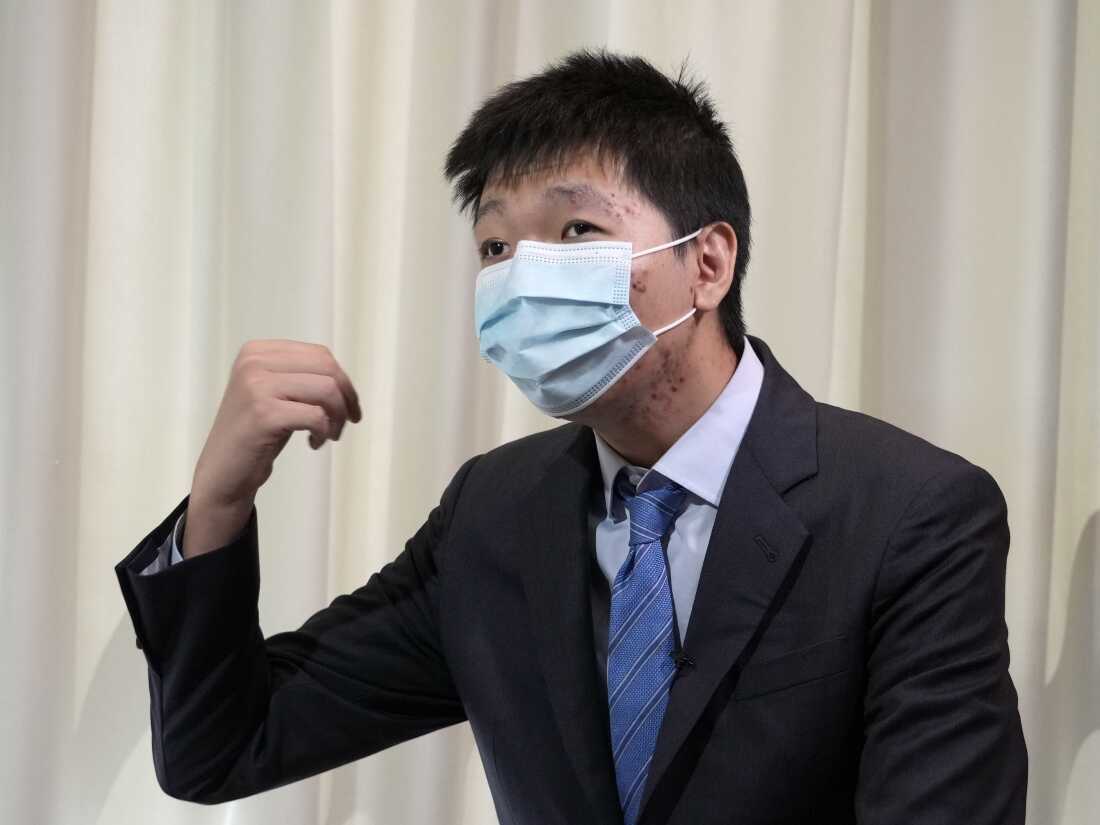 Wang Jingyu speaks during an interview in Ukraine on Wednesday, June 30, 2021. Wang told reporters that the Chinese government constantly harassed and threatened him. But an NPR investigation linked Wang to an elaborate con involving false claims of Chinese Communist Party repression. Wang insists he is a genuine victim and had no involvement in the scheme.  (AP Photo)