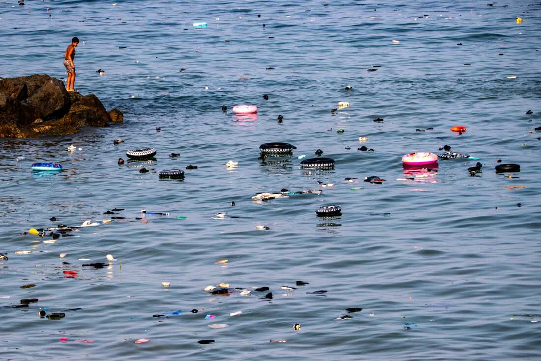 Belongings left behind by migrants float in the sea after they crossed from Morocco into the Spanish enclave of Ceuta, Thursday, July 30, 2026.