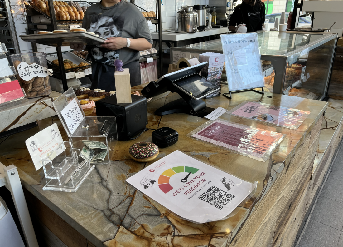 A QR code at Good Company Doughnuts in Arlington, Va., invites customers to provide feedback. The store's co-founder says reviews are just part of running a business now.
