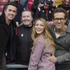 I comproprietari di Wrexham Ryan Reynolds (da destra), sua moglie Blake Lively e Rob McElhenney posano con i fan prima della partita di calcio della League One inglese tra Wrexham e Charlton Athletic all'ippodromo di Wrexham, Galles, il 26 aprile 2025.