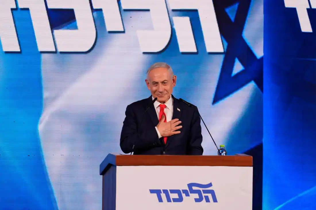 Israeli Prime Minister Benjamin Netanyahu gestures as he addresses supporters at the Likud party headquarters in Jerusalem after the first results of Israel's general elections were released, Wednesday, Oct. 28, 2026.