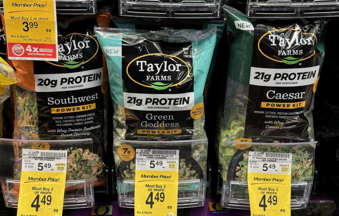 Falling grocery prices helped to keep inflation in check last month. Lettuce prices dropped sharply in July after an outbreak of food-borne illness prompted a recall of some leafy greens.